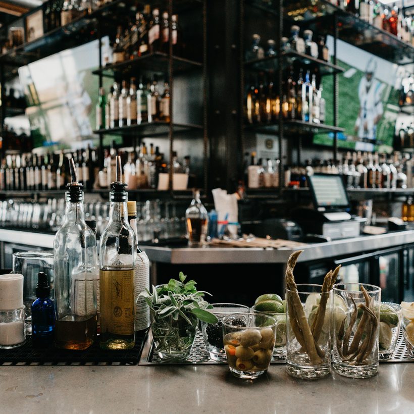 bar-countertop-with-garnishes-syrups-liquor-bottle-2022-11-11-09-54-08-utc